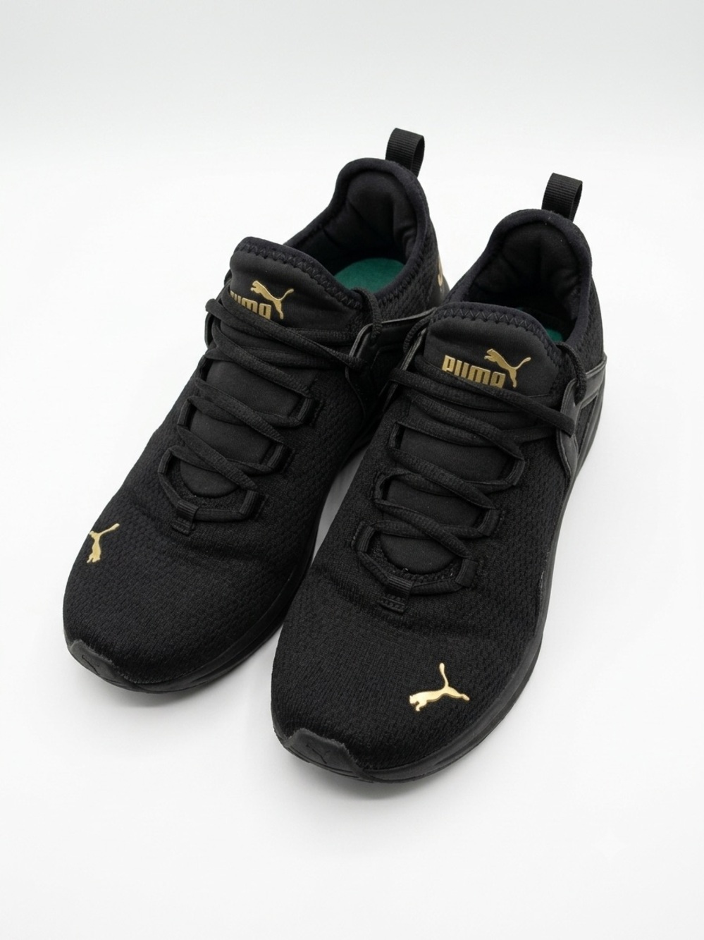 Puma Black Sneakers with Gold Branding